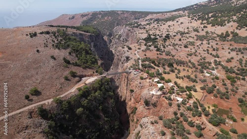 4K aerial drone shot of Aradena bridge and gorge or canyon, western scenario, dry landscape, summer, Crete photo