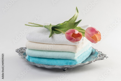 Light pastel blue towels, on a white background.