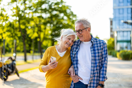 Senior couple in love walking in the city
 photo