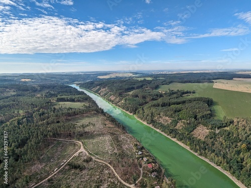 The Hracholusky dam with water power plant. The water reservoir on the river Mze. Source of renewable energy and popular recreational area in Western Bohemia. Czech Republic, Europe. green water
 photo