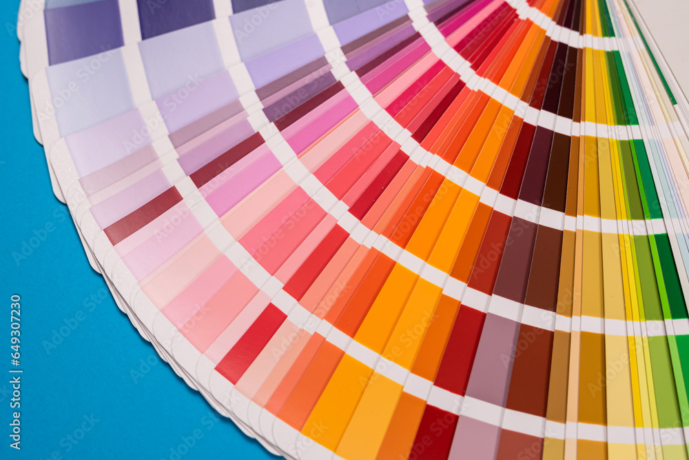 Obraz premium Catalog of paper color palette isolated on blue background