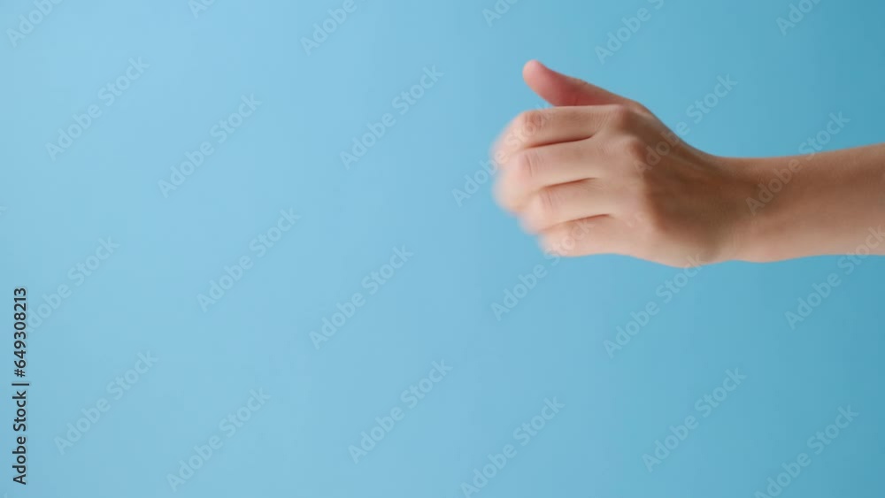 Vertical video of female hand pointing on you and Come closer isolated on blue studio background with copy space for advertisement. Body language concept. With place for text or promotional content Vertical video of female hand pointing on you and Come closer isolated on blue studio background with copy space for advertisement. Body language concept. With place for text or promotional content