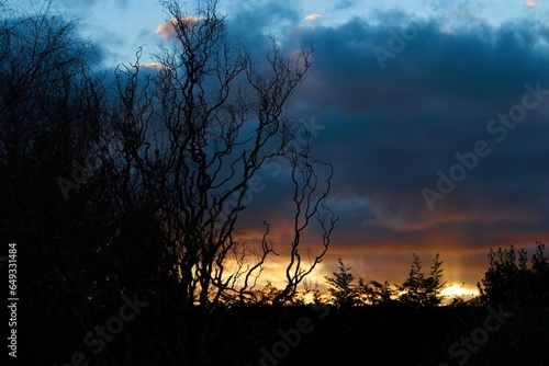 sunset poking through ominous clouds