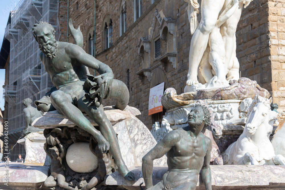statues of the Neptune fountain in Florence, Italy