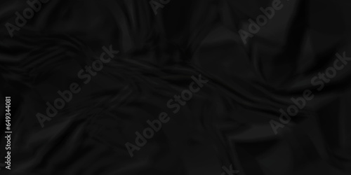 Dark crumple black paper wrinkled poster template ,blank glued creased paper texture background. black paper crumled backdrop background. used for cardboard and clarkboard.