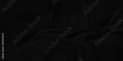 Dark crumple black paper wrinkled poster template ,blank glued creased paper texture background. black paper crumled backdrop background. used for cardboard and clarkboard.