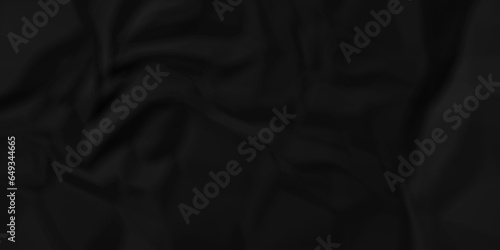 Dark crumple black paper wrinkled poster template ,blank glued creased paper texture background. black paper crumled backdrop background. used for cardboard and clarkboard.