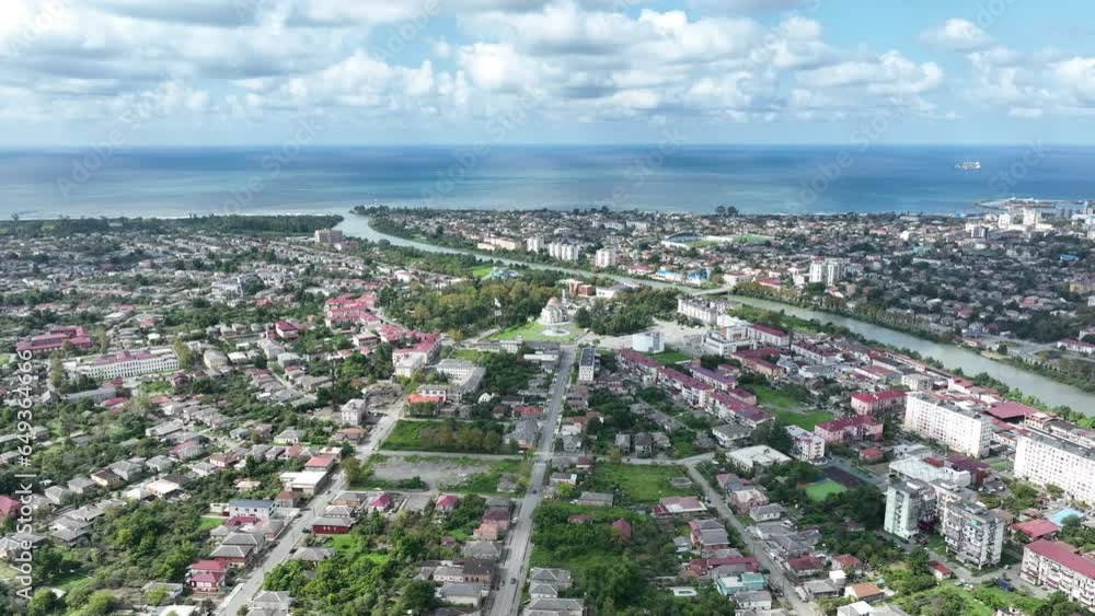 View from drone of modern landscape of Georgian port city of Poti overlooking residential areas and Orthodox Cathedral in Neo-Byzantine style on sunny summer day, Samegrelo-Zemo Svaneti region View from drone of modern landscape of Georgian port city of Poti overlooking residential areas and Orthodox Cathedral in Neo-Byzantine style on sunny summer day, Samegrelo-Zemo Svaneti region