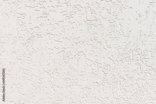 Texture of decorative plaster with a relief. White plaster Close-up.