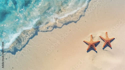 Starfish on the sand beach in clear sea water.