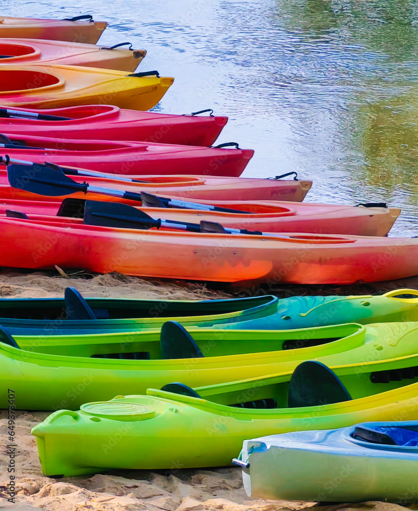 there are boats on the river bank. ready for river rafting there are boats on the river bank. ready for river rafting
