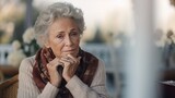 A sad and lonely old senior in her apartment. Generated AI