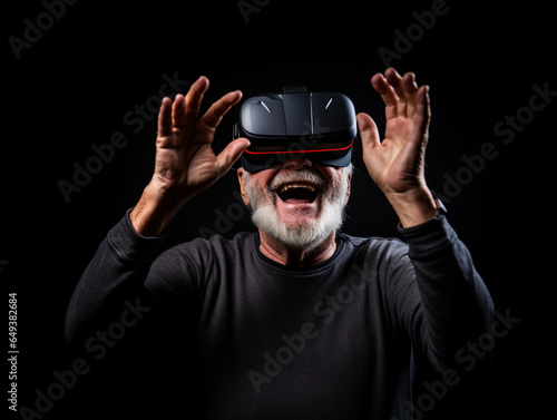 Older man playing with a virtual reality headset. Man surprised and having a good time. Black background. Generative AI © Josemchi