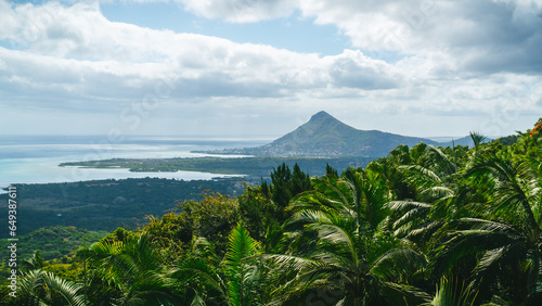 Le Morne Brabant or Tamarin Viewpoint located in the Black River Gorges National Park, Mauritius. In the background you can see the whole jungle or lush and green forest, the beach and the reef.