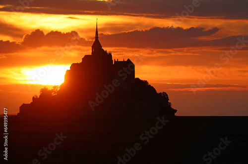 Breathtaking View with Abbey of Mont Saint Michel in Northern France at sunset