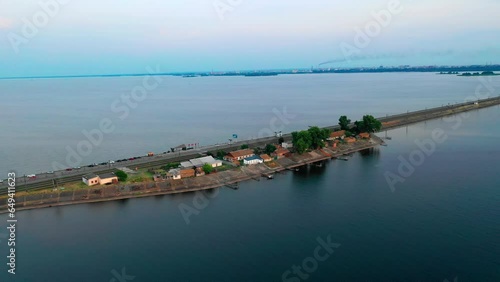 Aerial view, Panske, Ukraine, an isolated settlement located on Cherkasy Dam, the longest dam in Ukraine across Dnieper river.  photo