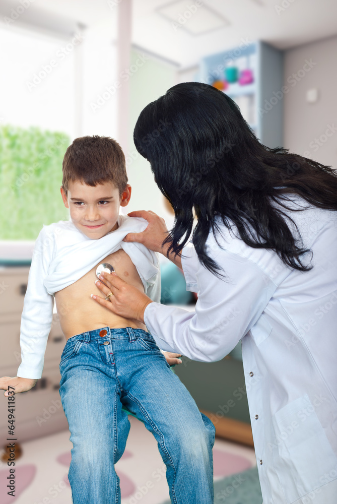 Fototapeta premium Doctor examining small boy