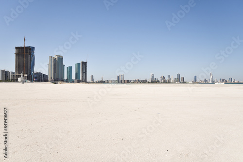 Manama Skyline with Skyscrapers and Desert Sand Beach in Kingdom of Bahrain