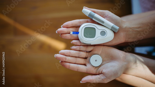 Принти на полотні Close up of hands with diabetes supplies and devices.
