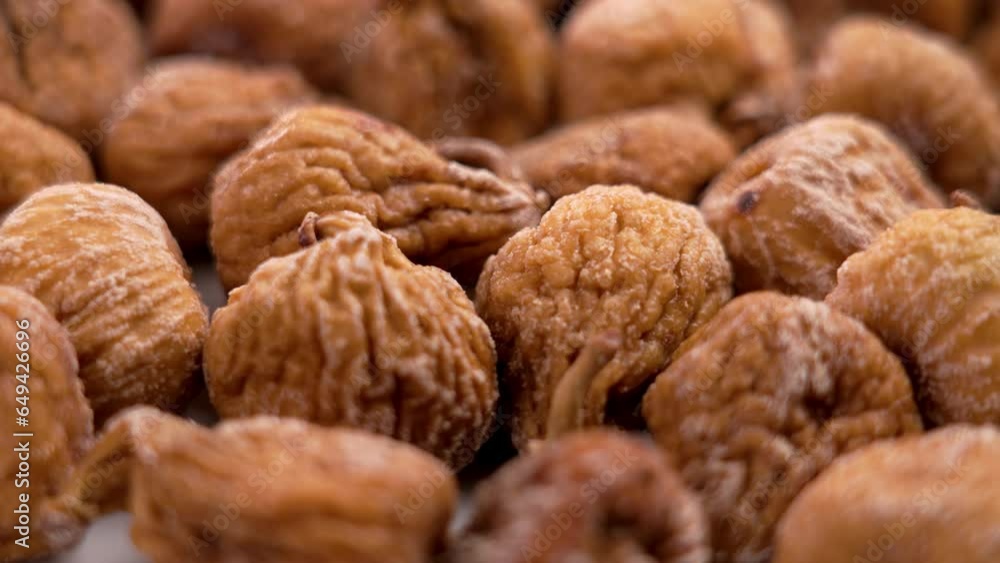 Dried figs with wrinkled peel close up. Rotation Dried figs with wrinkled peel close up. Rotation