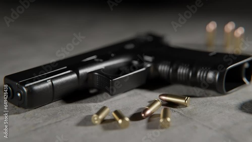 Bullets handgun laying on the floor . Bullets Handgun Gun Darkness photo
