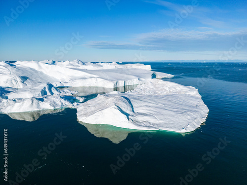 Greenland Ilulissat Icefjord Aerial View. Iceberg and glacier ice in Arctic nature landscape in Greenland. Ilulissat, Disko Bay, Baffin Sea, Greenland. 