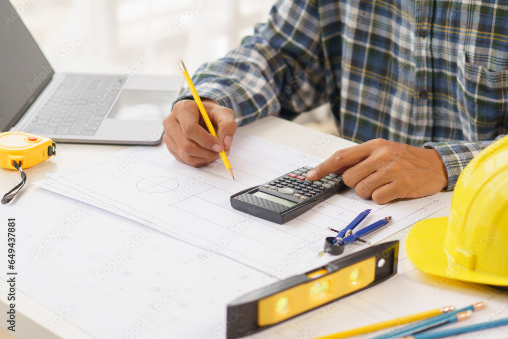 A home architect is reviewing a draft house plan. Projects assigned by customers and customized design before delivery Interior design and decoration ideas, African American, Indian