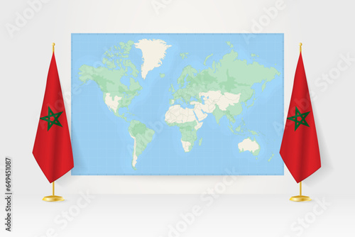 World Map between two hanging flags of Morocco flag stand.