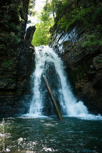 a small waterfall on a mountain river