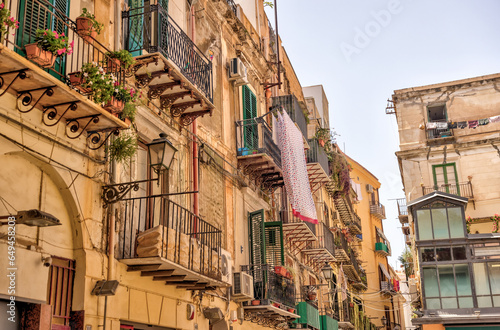 Palermo, Italy - July 18, 2022: Classic architecture and building facades on the streets in Palermo  © Torval Mork