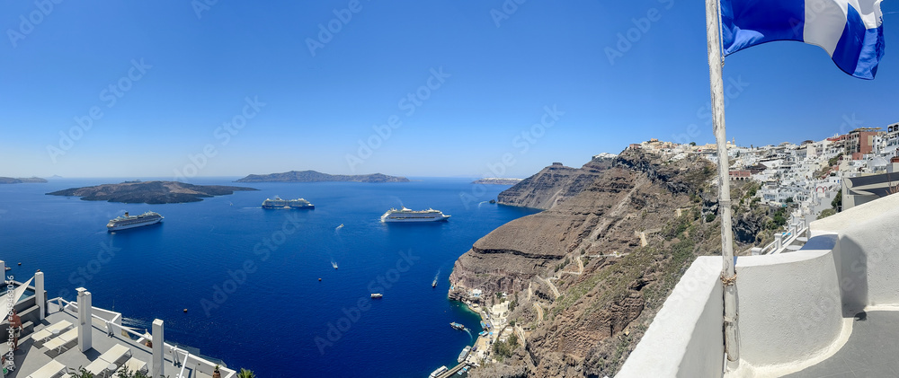 Fira, Greece - July 20, 2023: Views of cruise ships and the rocky landscapes from Fira on the island of Santorini in Greece
 - obrazy, fototapety, plakaty 