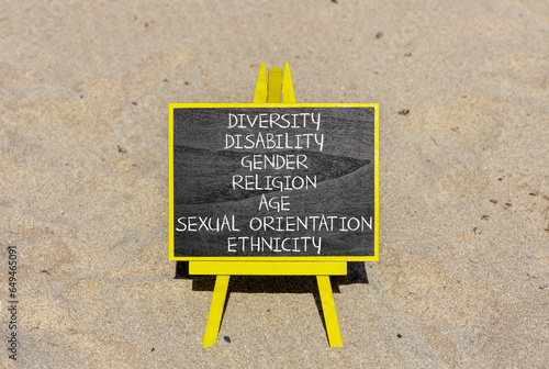 Diversity ethnicity gender age sexual orientation religion disability words written on black chalk blackboard on a beautiful sand background. Equality diversity ethnicity gender disability concept.