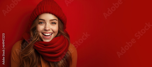 Happy Woman with Red Scarf and Hat with Space for Copy on a Red Background