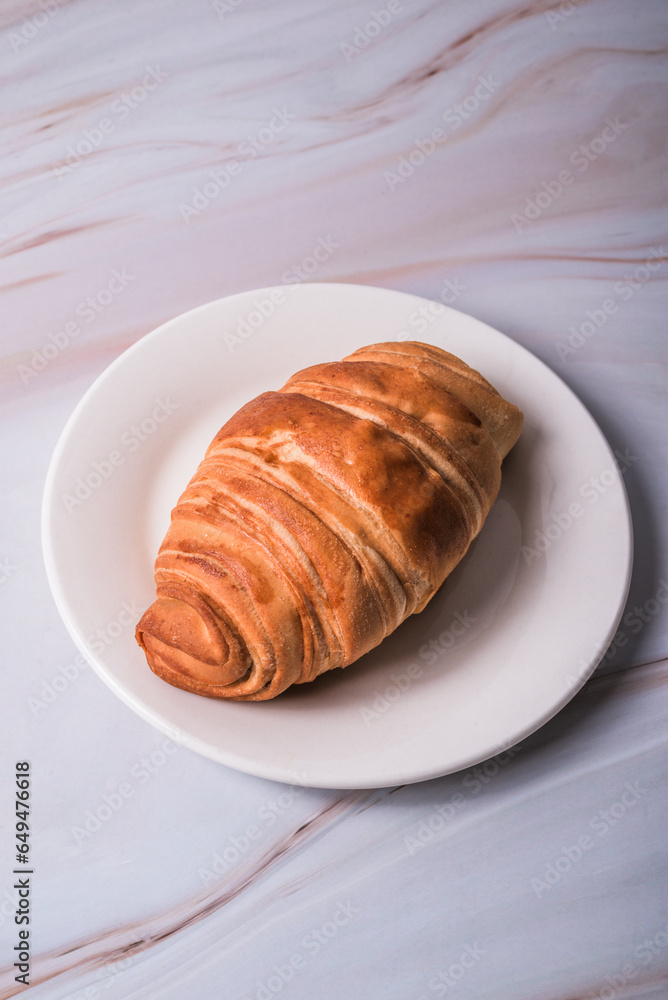 croissant bread on a plate.