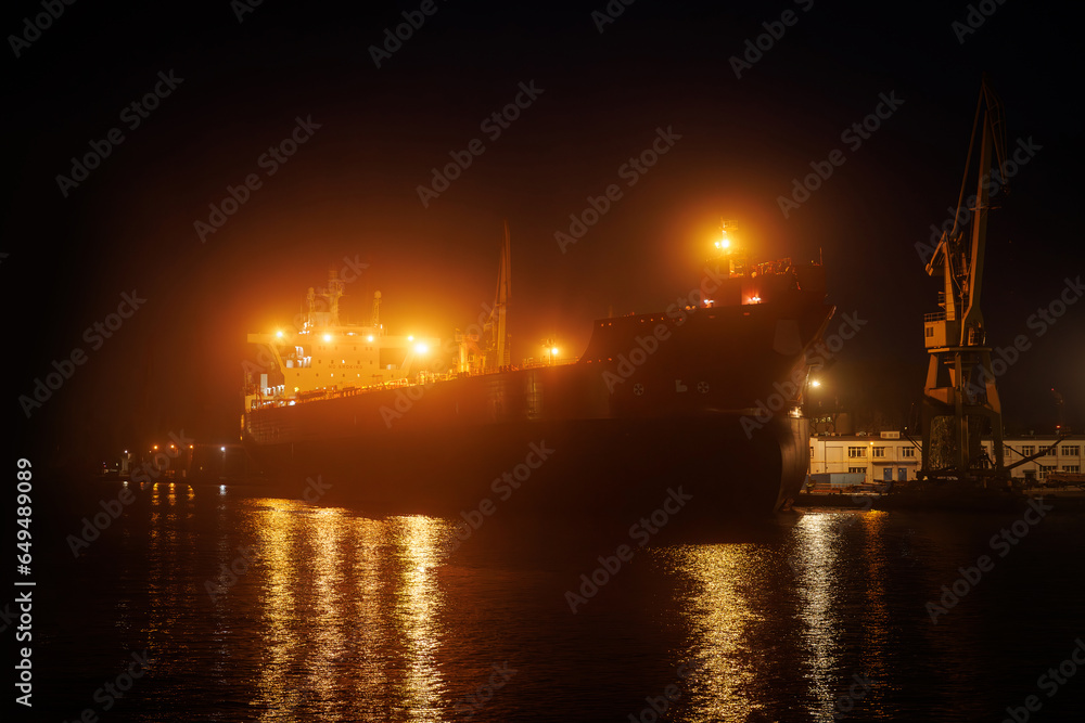 Ocean tanker loading at dock.