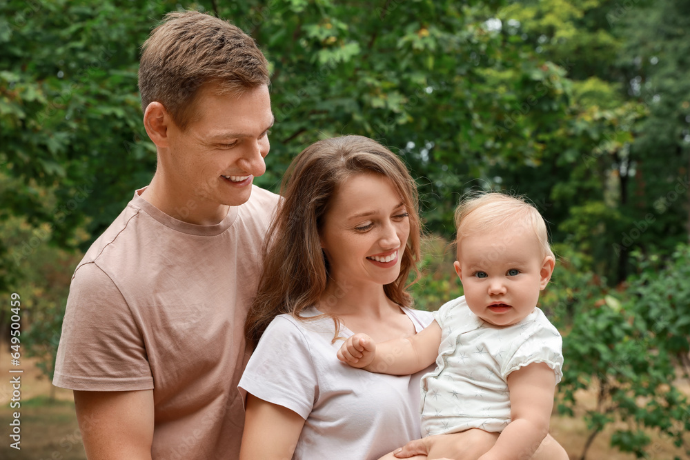 Parents with their cute baby spending time together outdoors. Happy family Parents with their cute baby spending time together outdoors. Happy family