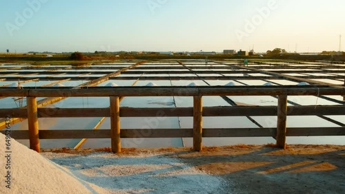 The salt ponds or salt fields of Aveiro, Portugal by sunset, perfect shimmering mirrors that capture the essence of this coastal town