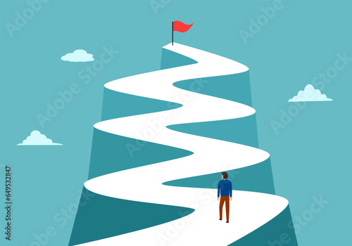 Businessman walking to the success flag on top of the mountain. Route to success. Leadership concept.