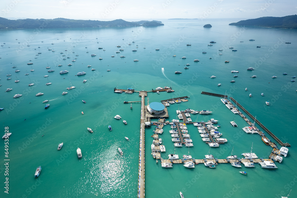 Aerial View Drone shot of Yacht and sailboat parking in marina, Transportation and travel background, Beautiful sea in summer season