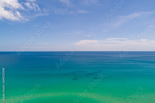 Waves sea water surface nature background,Sun rays over sea, Bird's eye view ocean in sunny day,Sea ocean waves water background © panya99