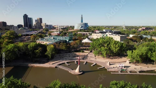 Gorgeous cinematic aerial of downtown Winnipeg, MB, Canada. Forks Waterfront and Assiniboine River in foreground. photo