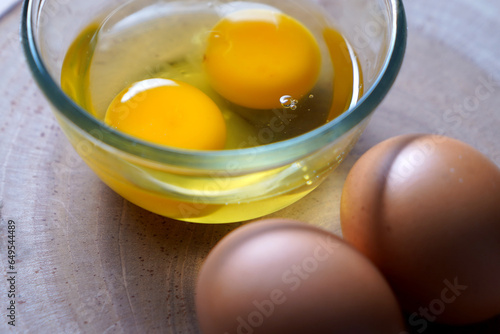 fresh two raw egg yolks in a glass bowl at wooden background.
Egg Yolk contain protein, vitamins, minerals, omega3 and other nutrients. 