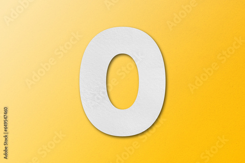 White paper font number 0 isolated on yellow background.