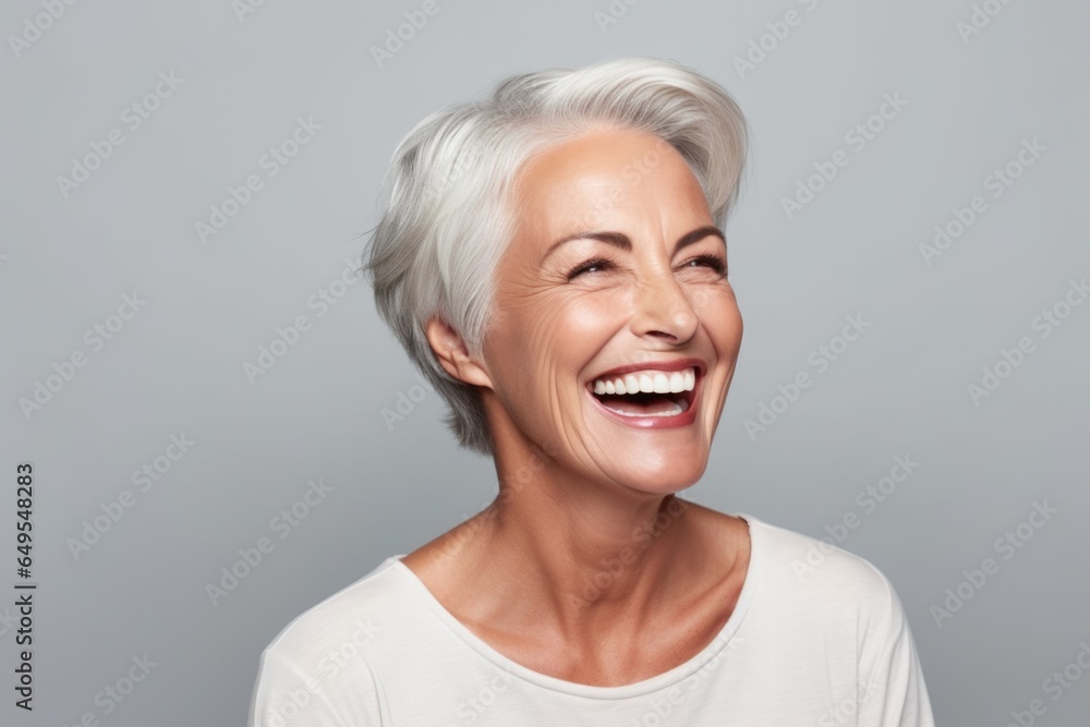 Beautiful gorgeous 50yo mid age beautiful elderly senior woman with grey hair laughing and smiling. Mature old lady close up portrait. Healthy face skin care beauty, skincare cosmetics, dental. Beautiful gorgeous 50yo mid age beautiful elderly senior woman with grey hair laughing and smiling. Mature old lady close up portrait. Healthy face skin care beauty, skincare cosmetics, dental.