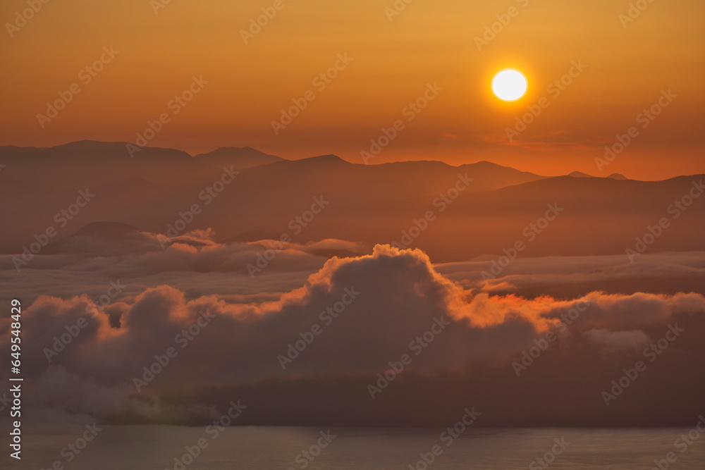 Fototapeta premium Hokkaido, Japan - September 8, 2023: The morning sun and sea of clouds over Lake Kussharo, Hokkaido, Japan 