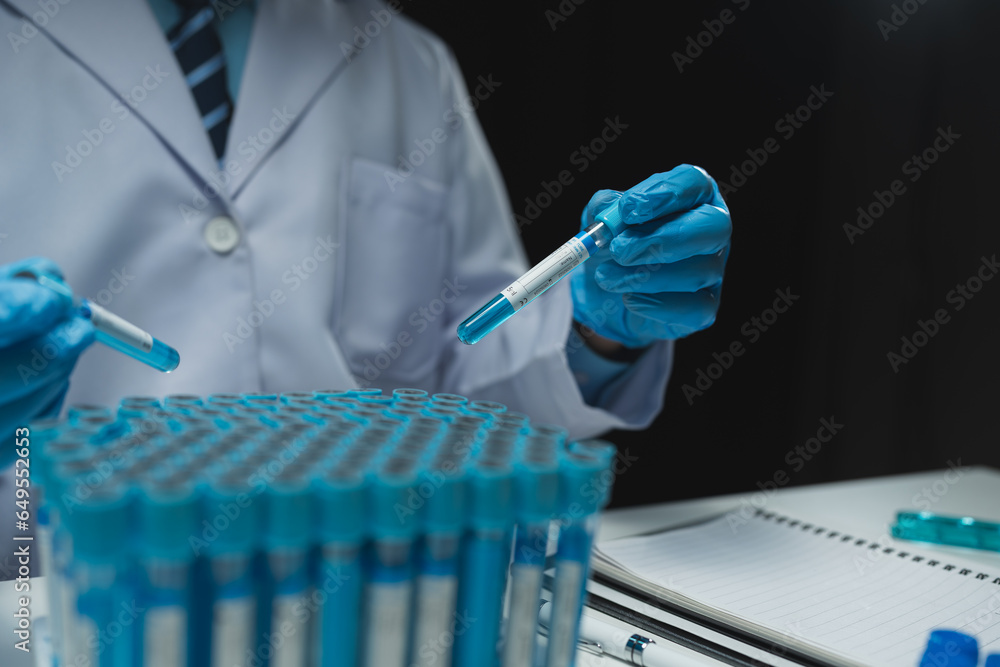 medical research laboratory Asian male scientist working using digital tablet analyze the sample record biochemical data medical science laboratory development of microbiology advanced equipment. medical research laboratory Asian male scientist working using digital tablet analyze the sample record biochemical data medical science laboratory development of microbiology advanced equipment.