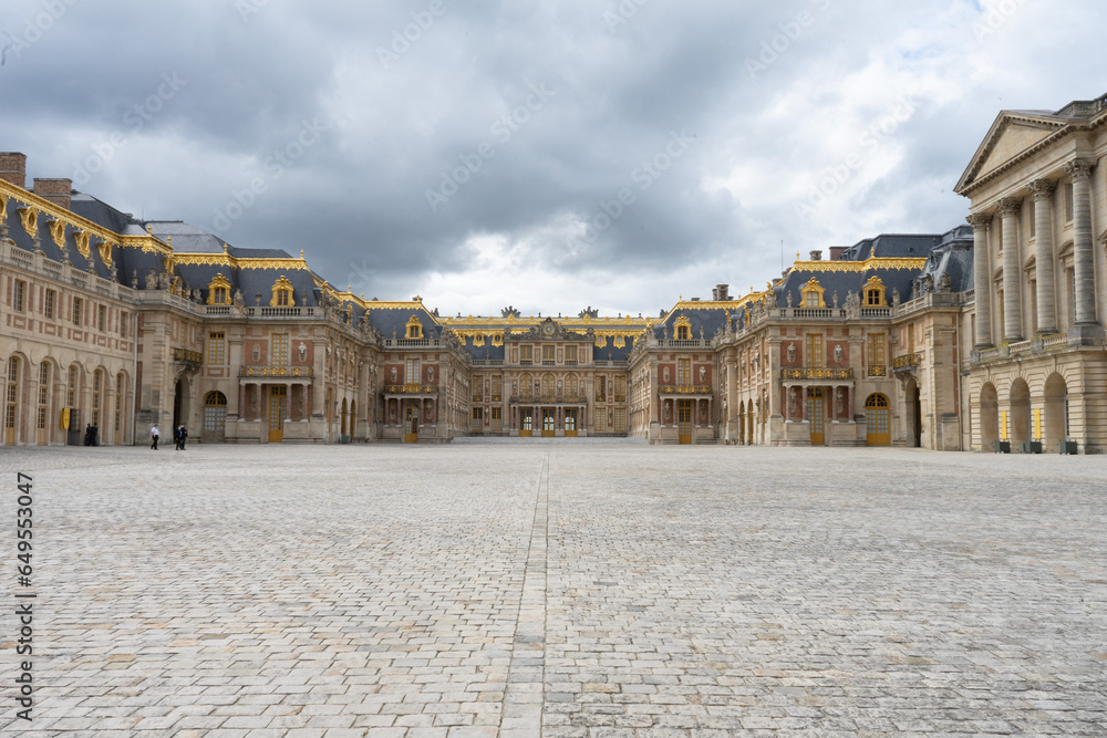 Panoramic image of the Palace of Versailles in Paris, France on a cloudy day