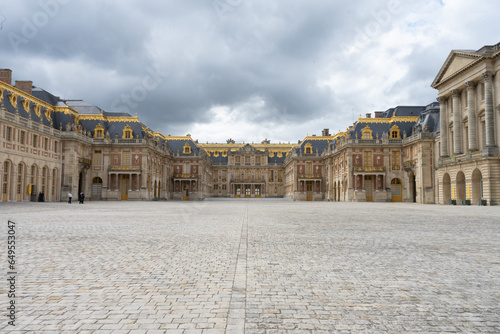 Panoramic image of the Palace of Versailles in Paris, France on a cloudy day