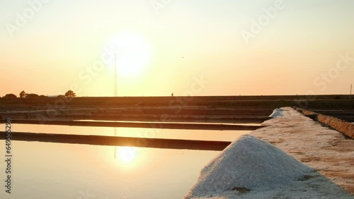 The salt ponds or salt fields of Aveiro, Portugal by sunset, perfect shimmering mirrors that capture the essence of this coastal town