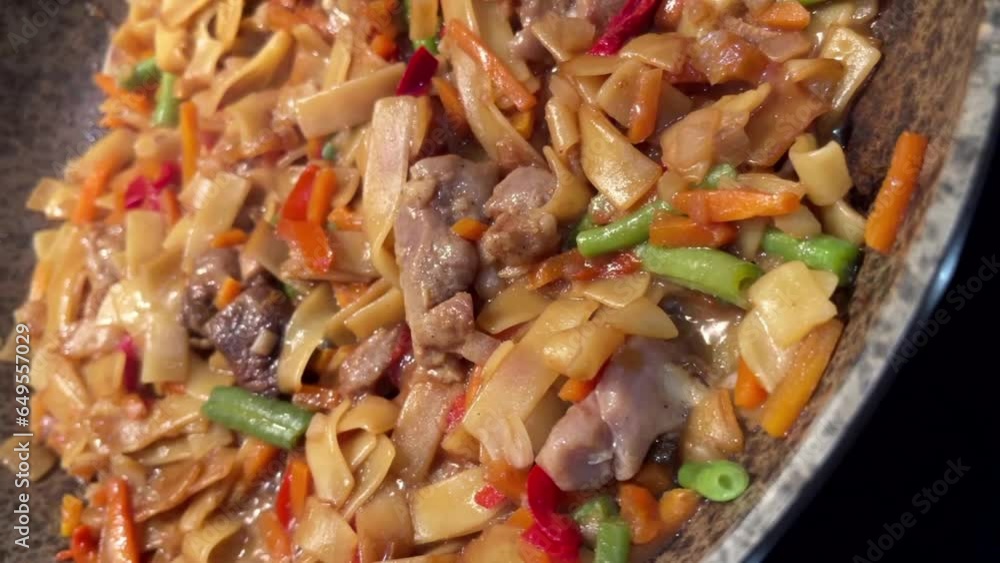 Yakisoba noodles meat vegetables frozen food cooked in a frying pan video Yakisoba noodles meat vegetables frozen food cooked in a frying pan video